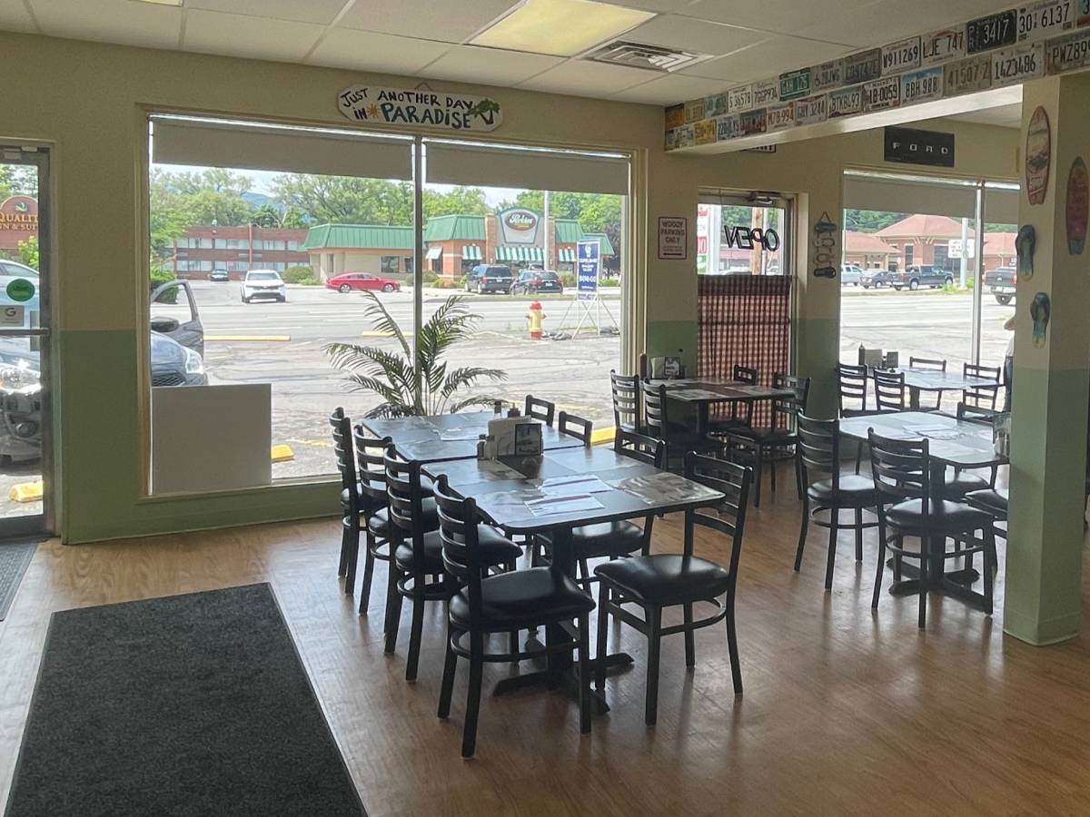 Dining tables by the front windows